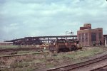 BM 1230 & BM 802 haul welded rail for the MBTA Green Line 'D' Branch past Boston Engine Terminal